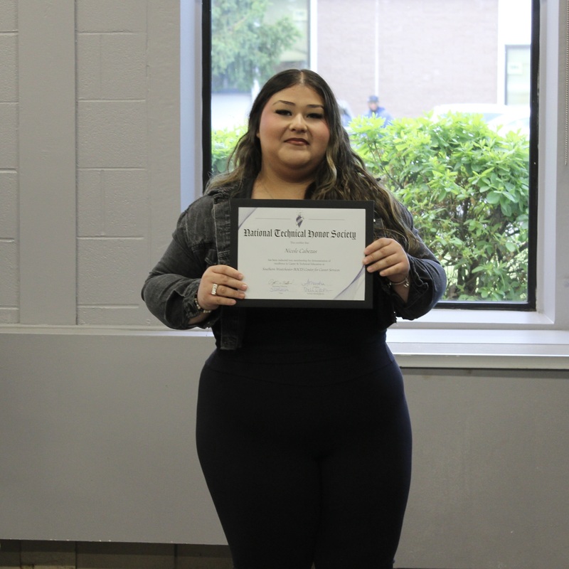 Students received a certificate to mark their NTHS induction.