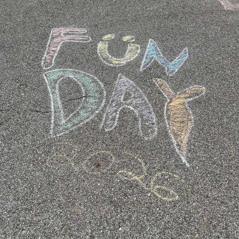 the words Fun Day 2026 chalked on pavement