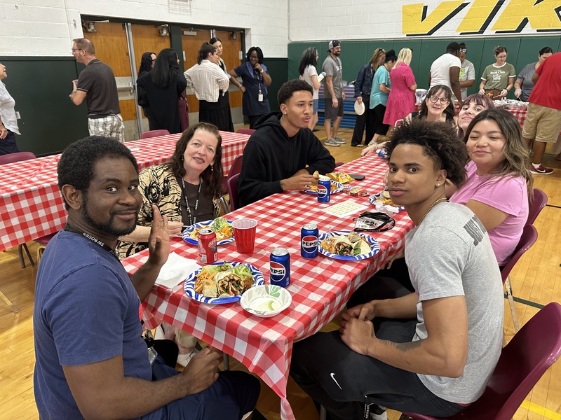 staff at table enjoy luncheon