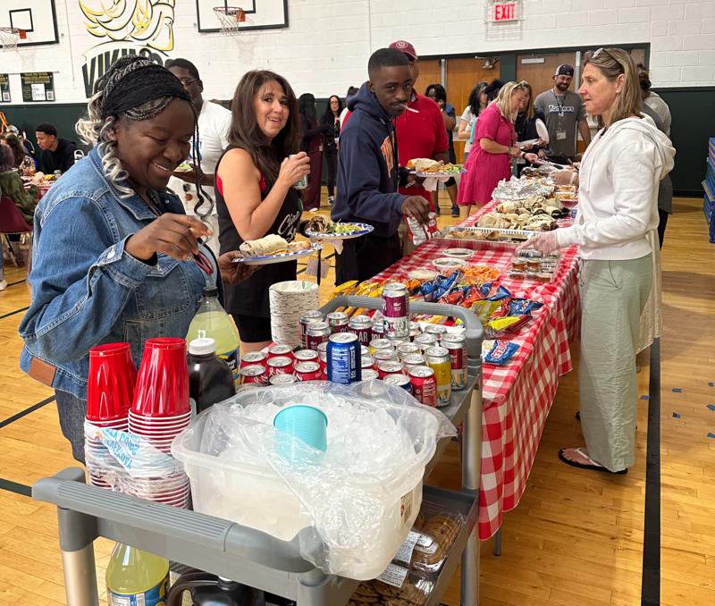 staff enjoys the buffet lunch