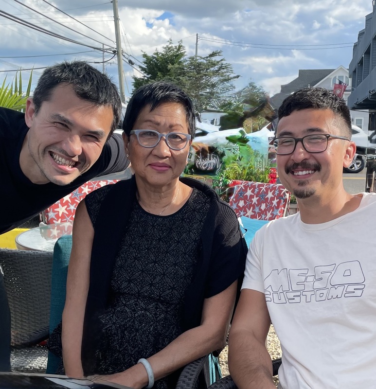 Eileen Yip (center) is pictured with her sons.