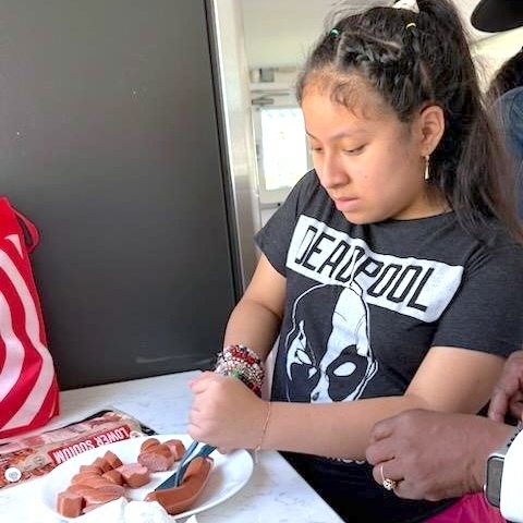 student prepares breakfast during extended school year class