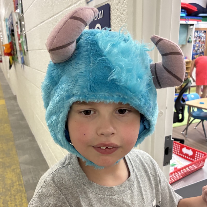 boy in a blue fuzzy hat with horns