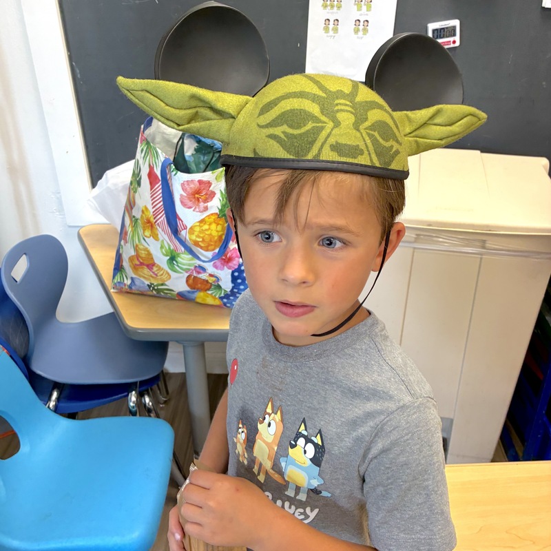 Boy wearing Yoda hat