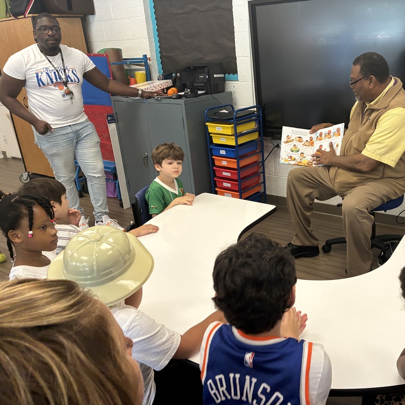 superintendent reads to students in class