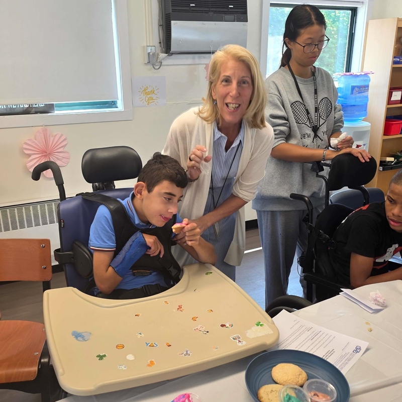 administrator and students enjoy test of life skills space