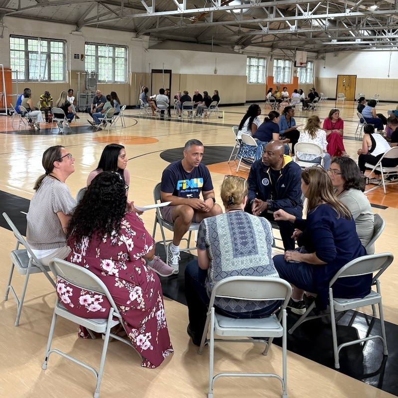 teachers from different programs meet and collaborate