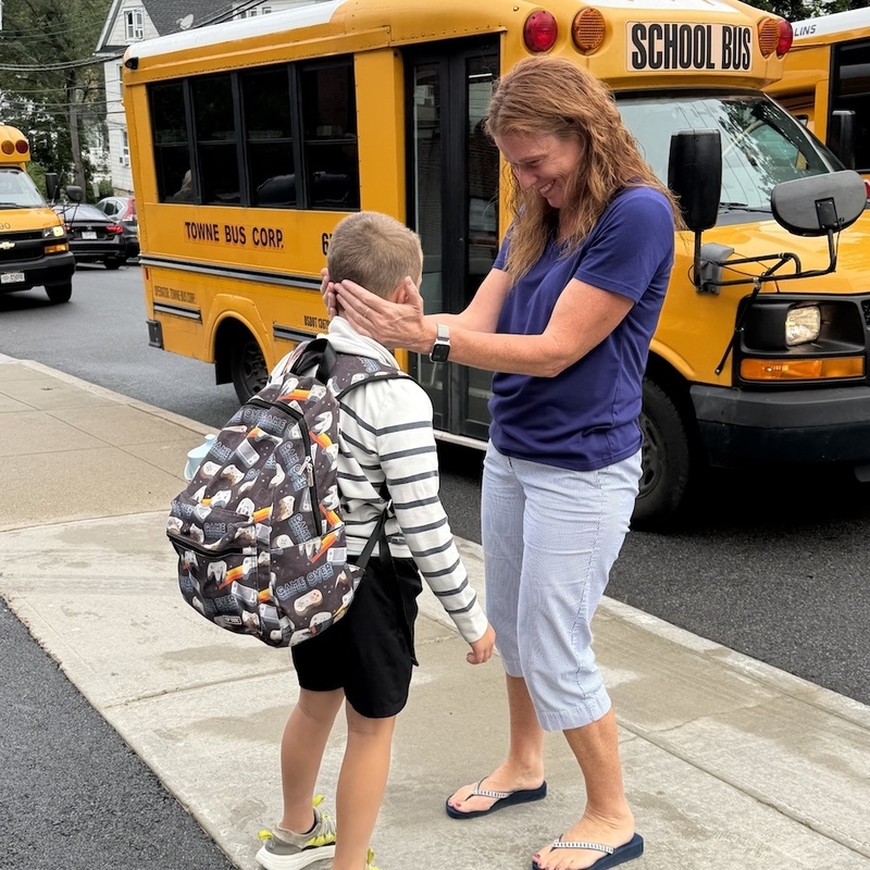 mom and son at bus drop off