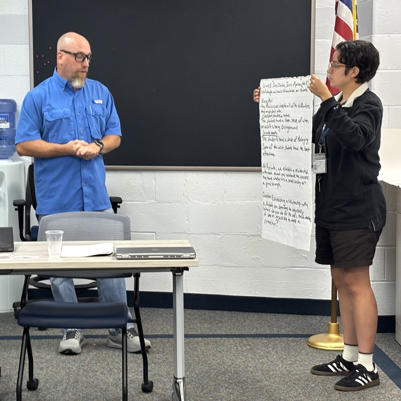 two teachers work on project together