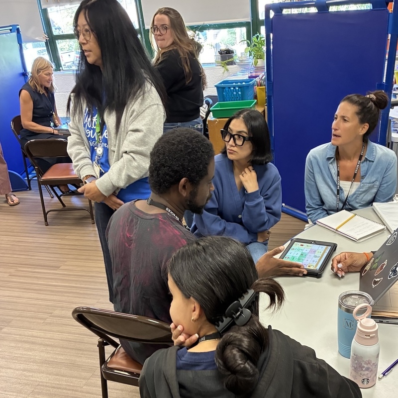 teachers look on during presentation