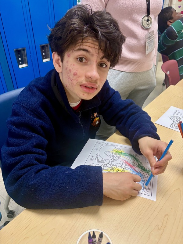 boy draws st. patrick's day designs