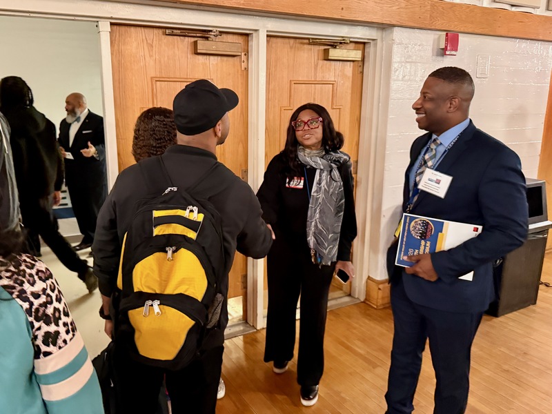 greeters at symposium welcome keynote speaker
