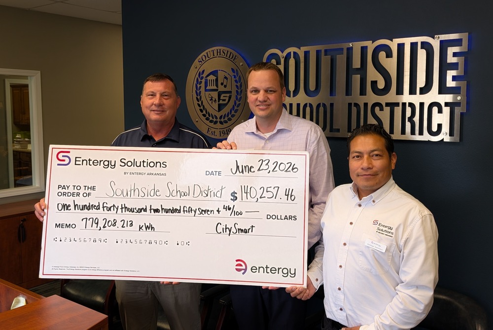 Three men holding large check to Southside School District