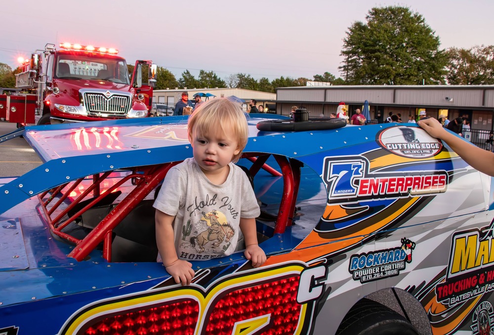 Preschooler in racecar
