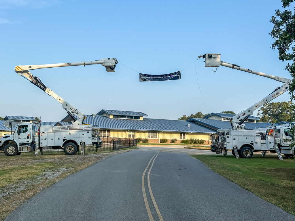 Entergy trucks and banner