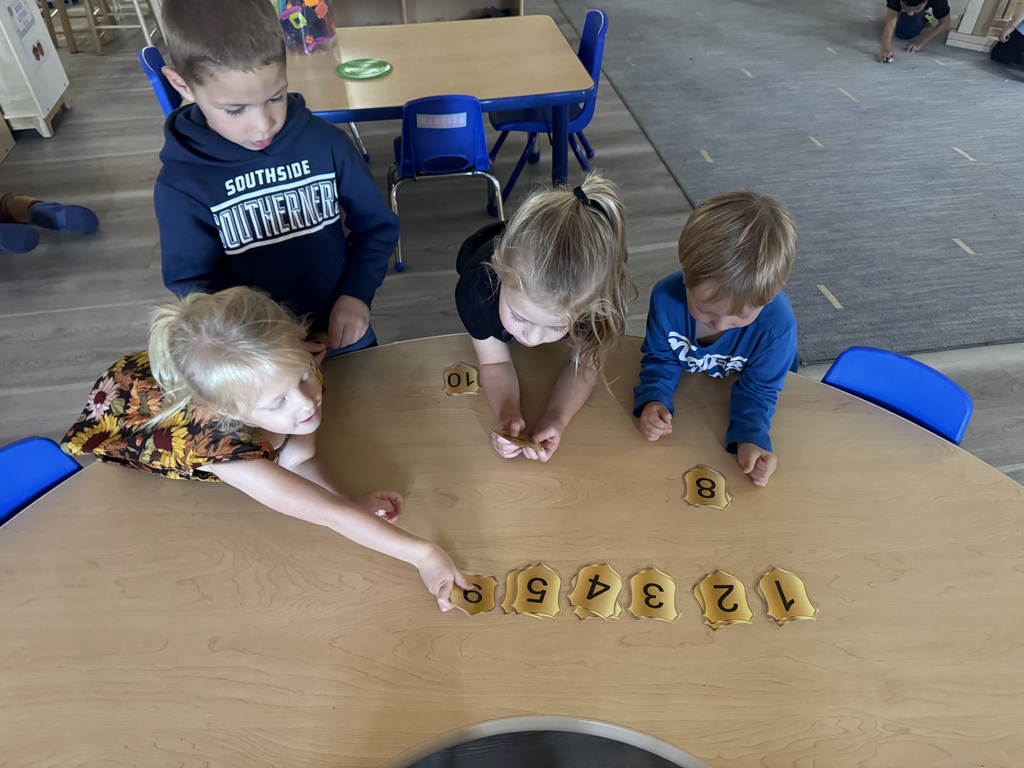 children putting numbers in order