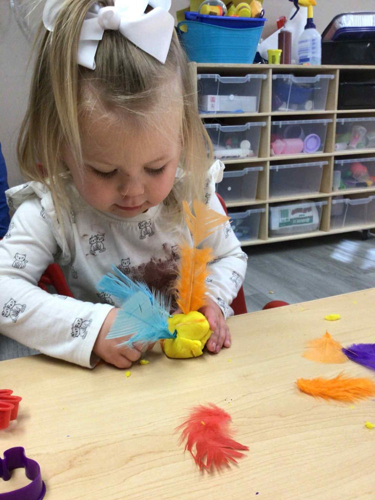 child making playdoh turkey 