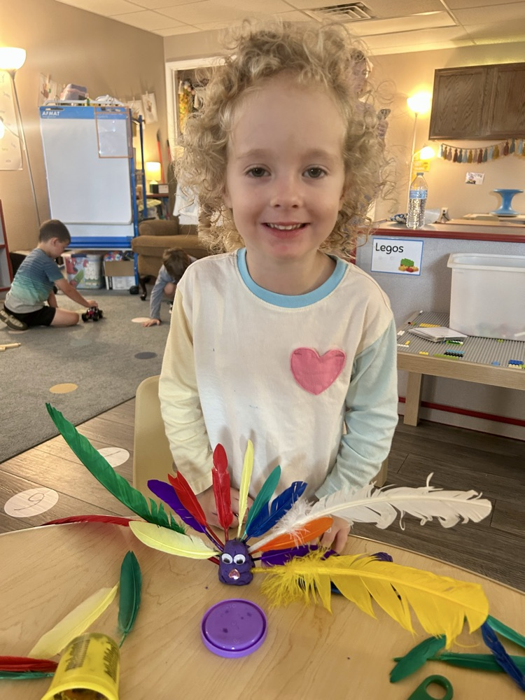 child made turkey with playdoh and feathers 