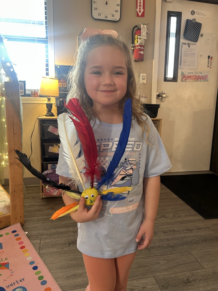 child made turkey with playdoh and feathers