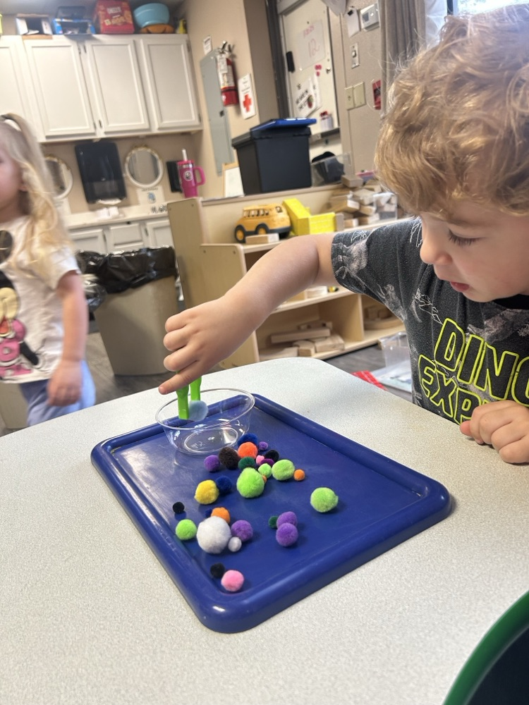 child doing fine motor activity 