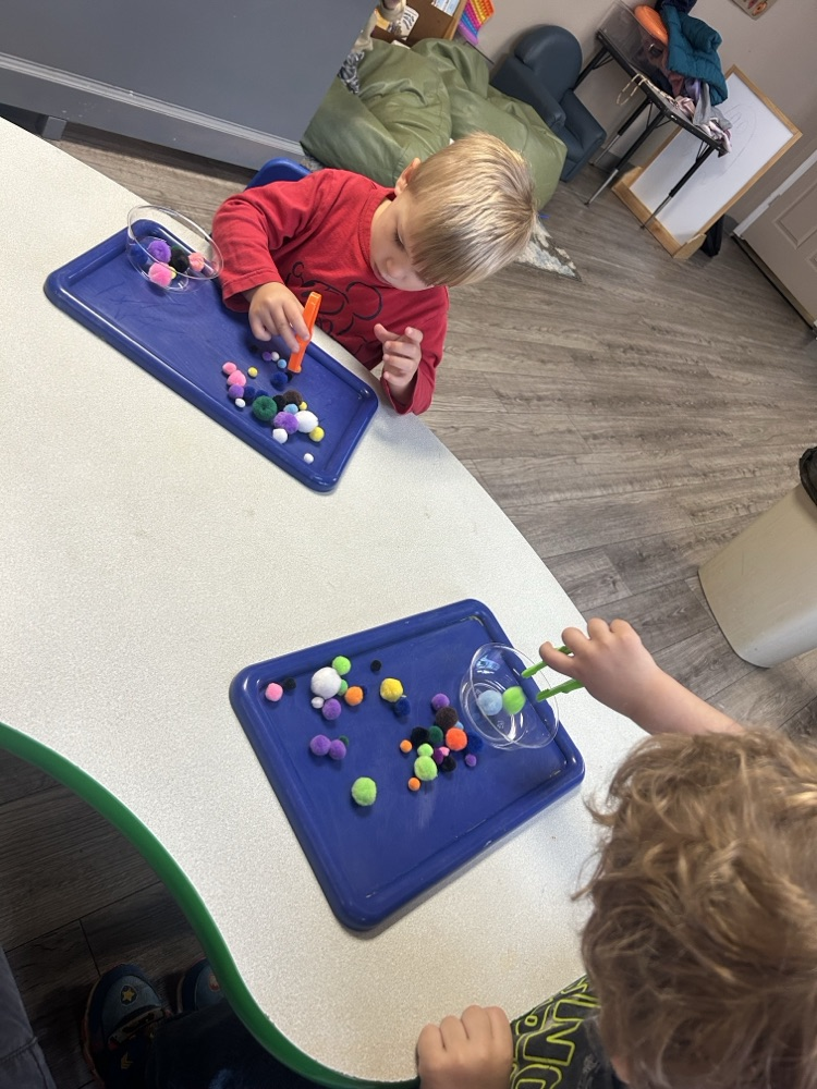 child doing fine motor activity 