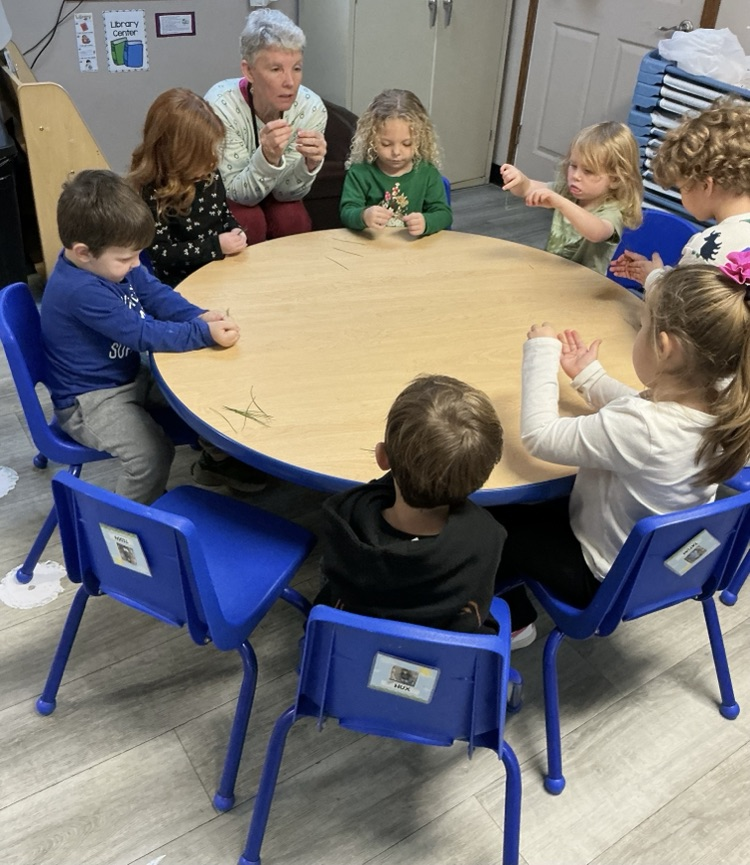 children talking with teacher