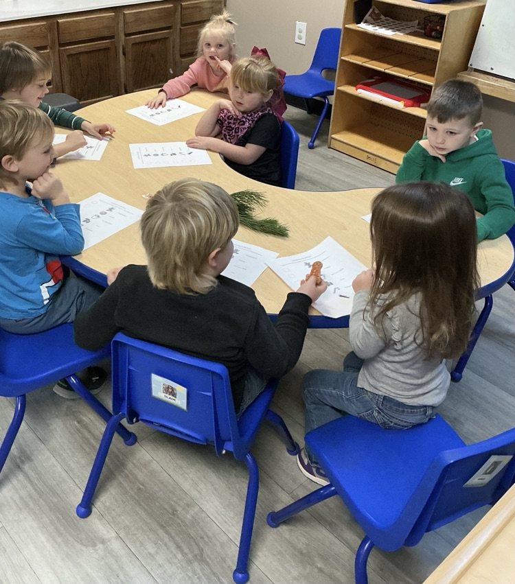 children talking with each other at table