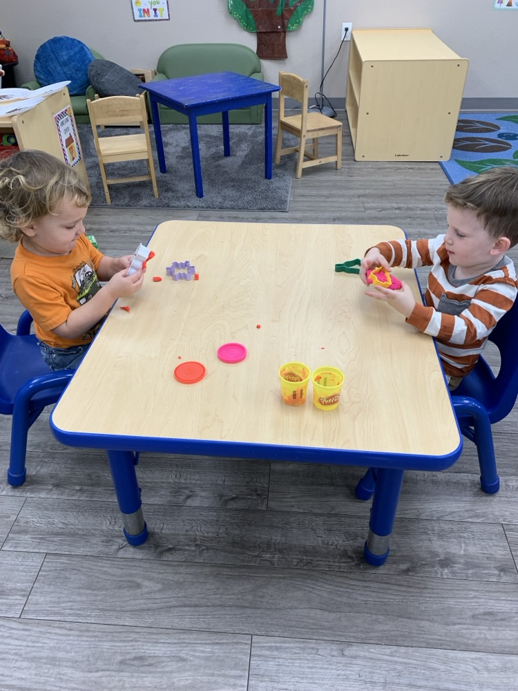 children playing with playdoh