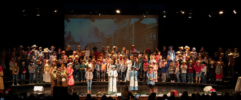 students and director on stage