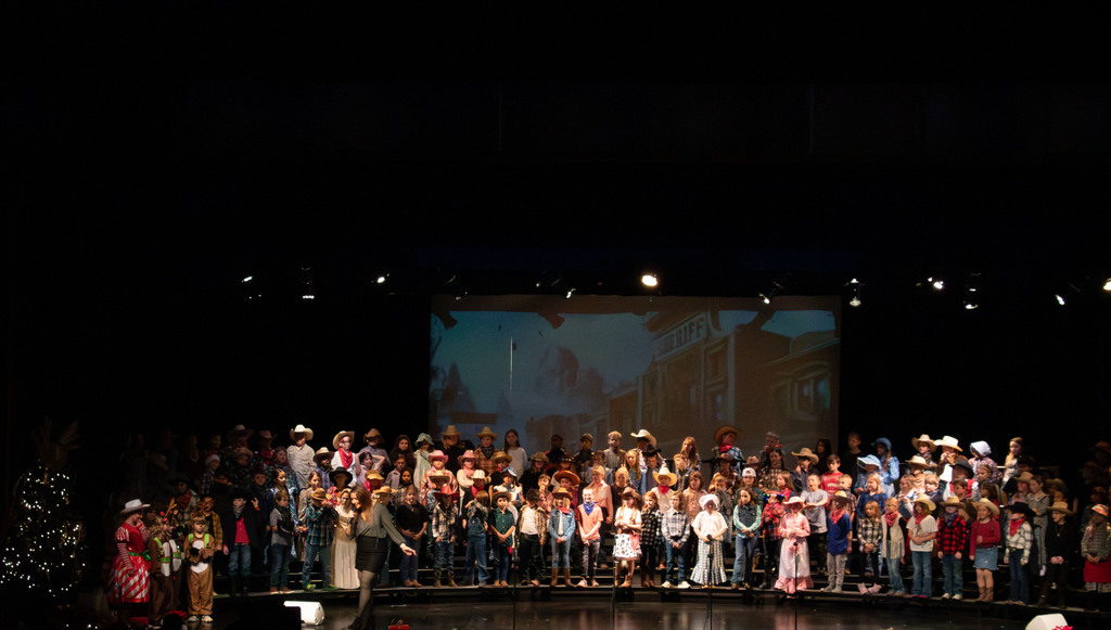 students and director on stage