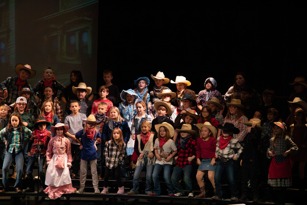 students and director on stage