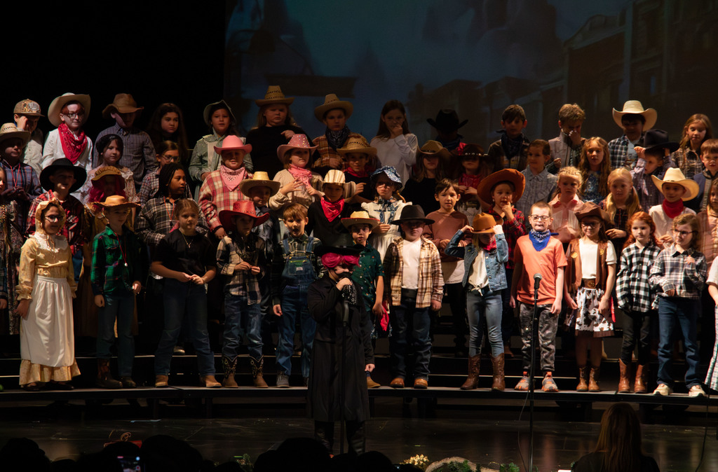students and director on stage