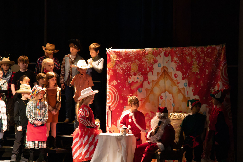 students and director on stage