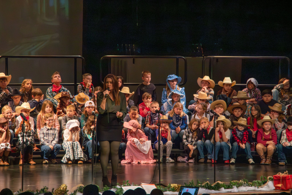 students and director on stage