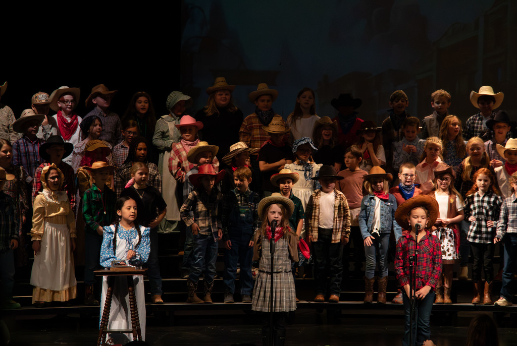 students and director on stage