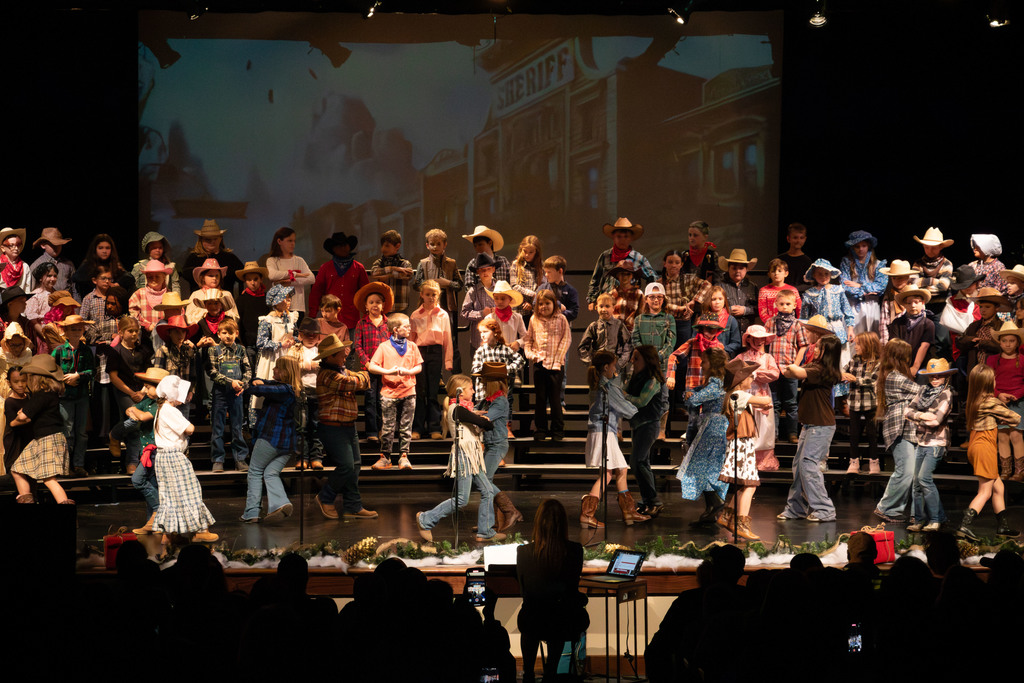 students and director on stage