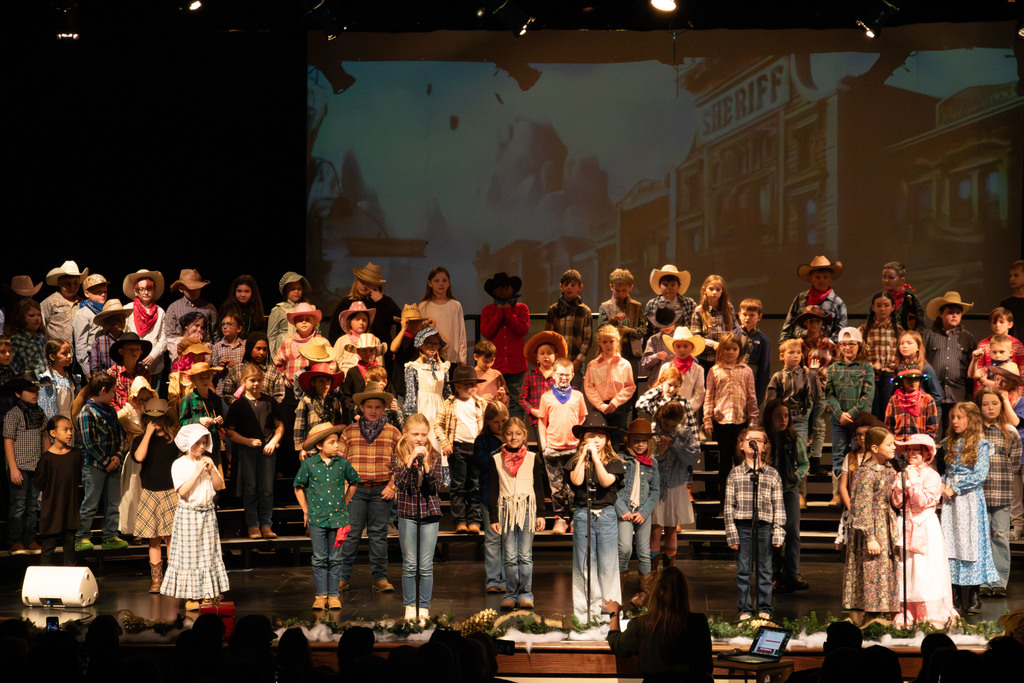 students and director on stage