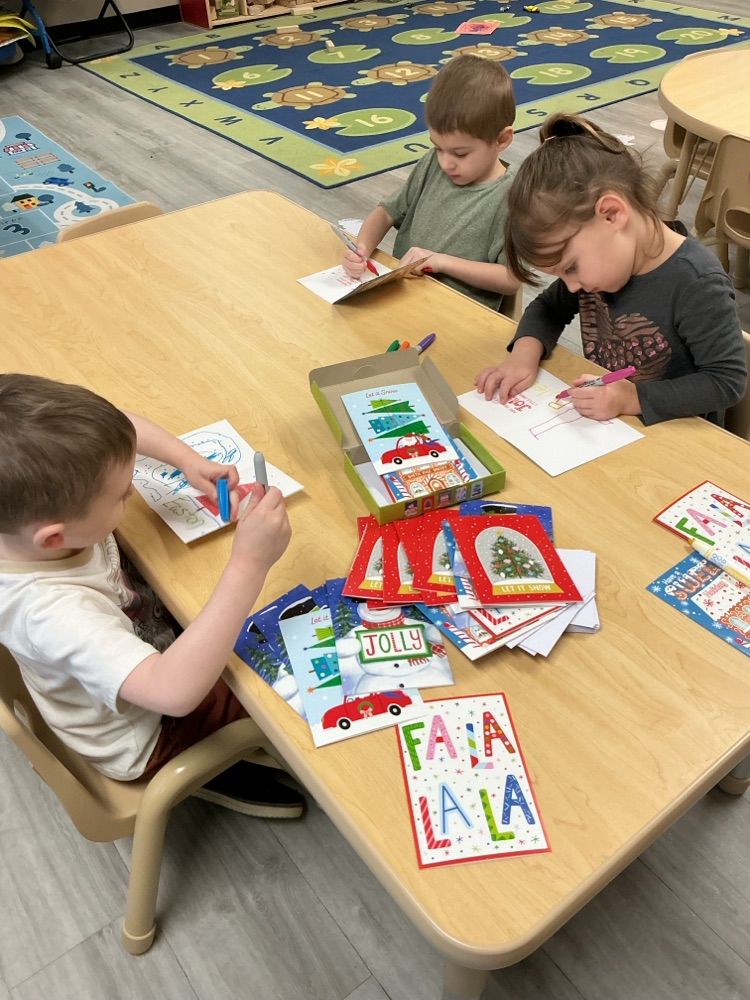 kids practicing writing names