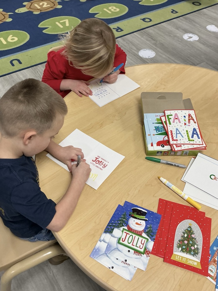 kids practicing writing names 