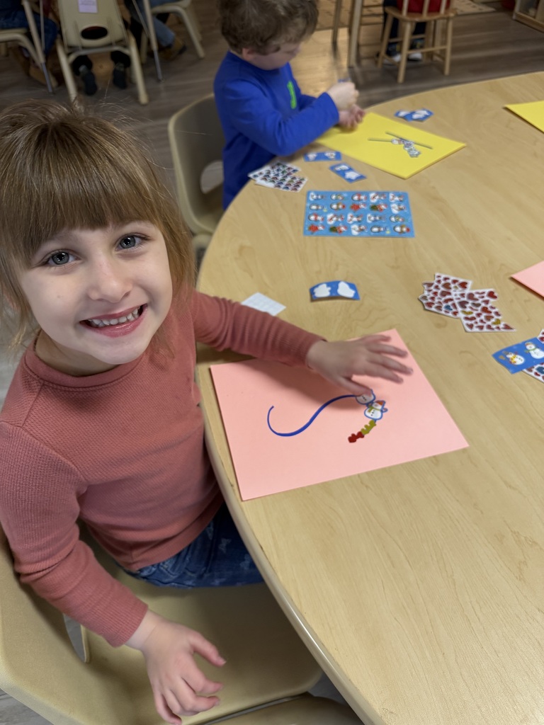Child playing with stickers