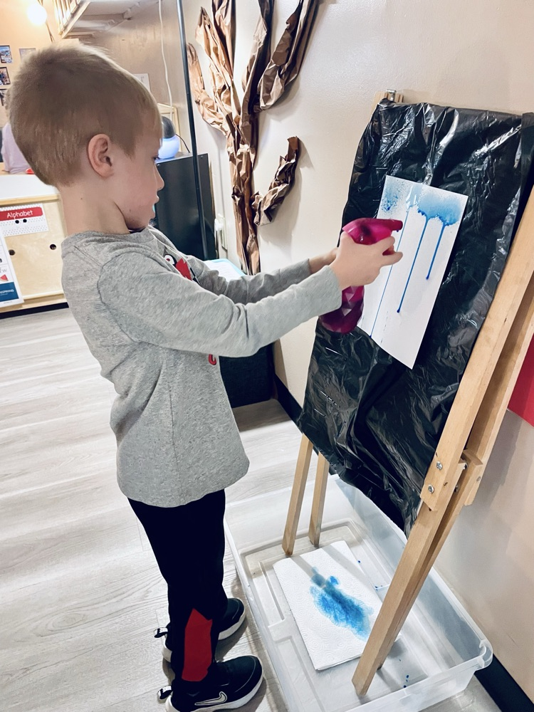 child doing rain art activity