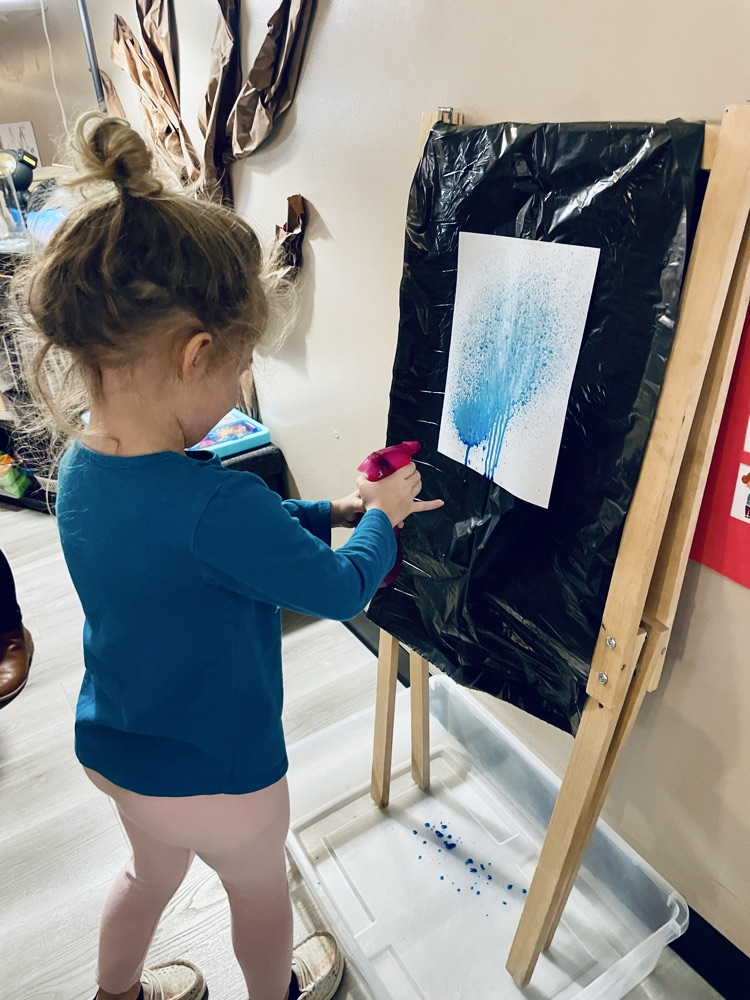 child doing rain art activity