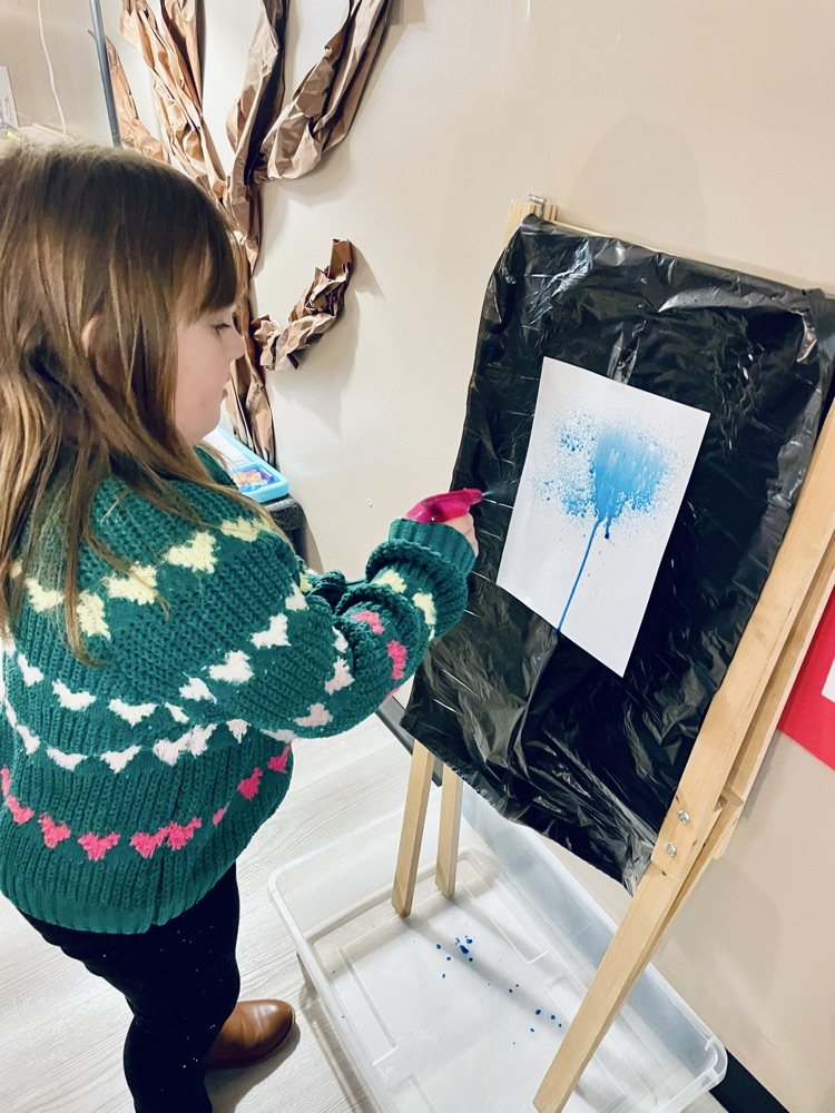 child doing rain art activity