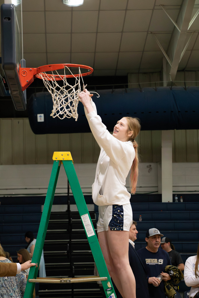 Girl cutting net down