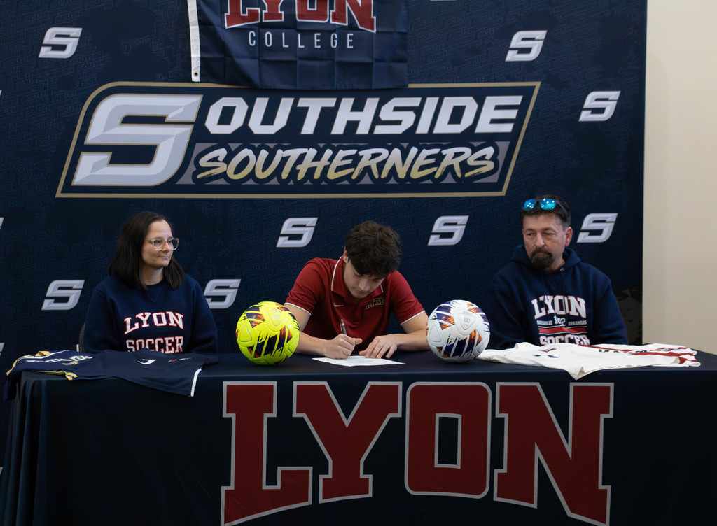 2 coaches player signing document