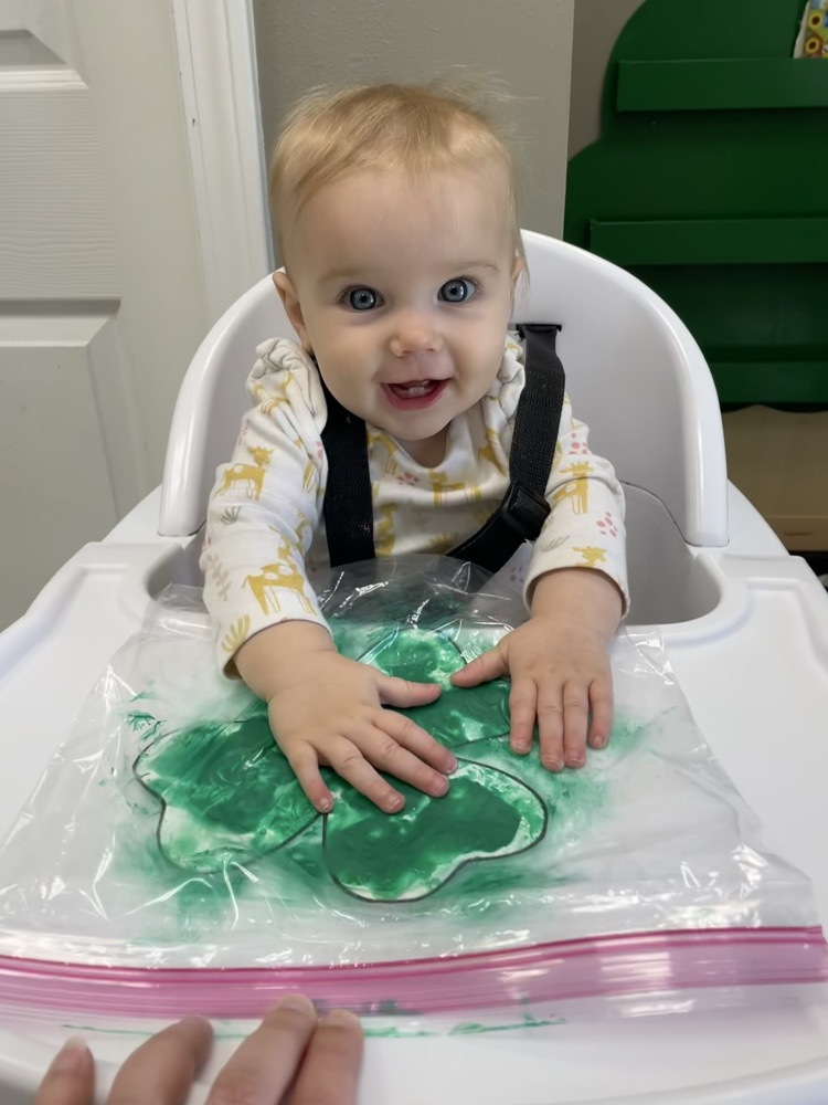baby doing sensory play