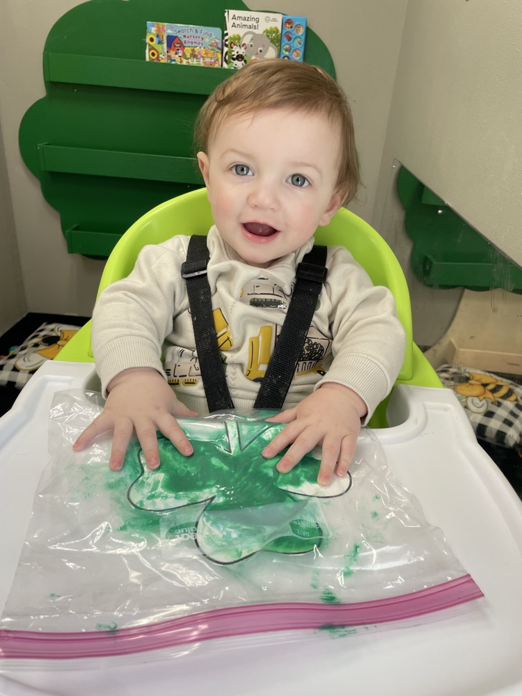 baby doing sensory play