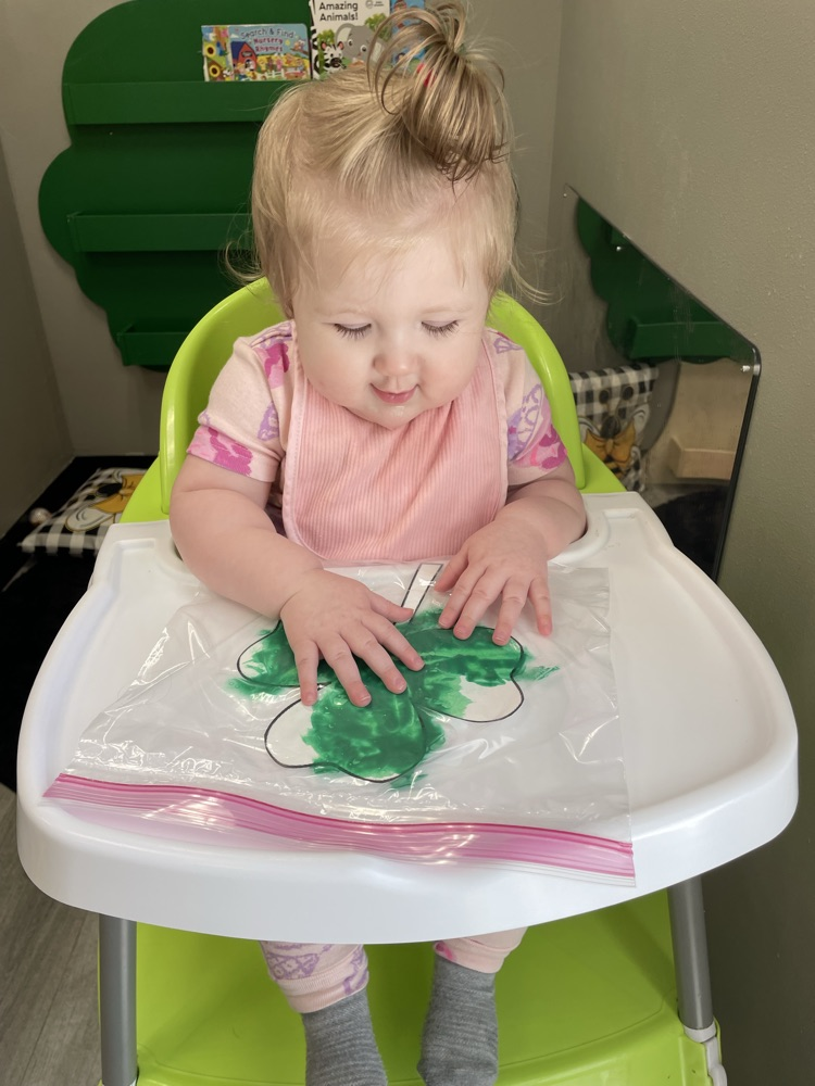 baby doing sensory play