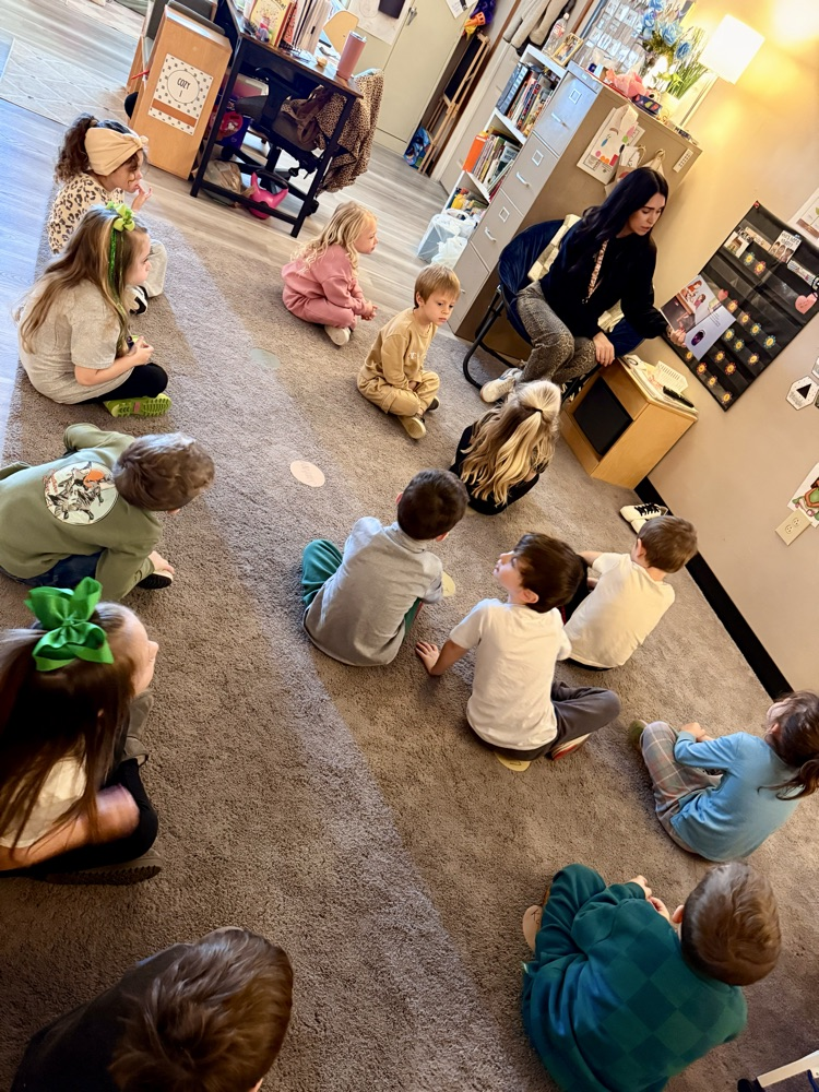 children listening to teacher read book