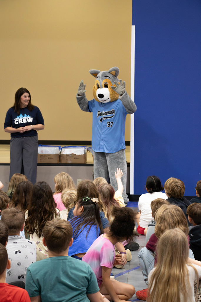 students, bank representative and squirrel mascot 